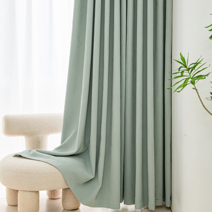 a white chair sitting in front of a window