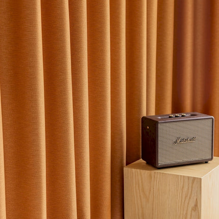a radio sitting on top of a wooden block