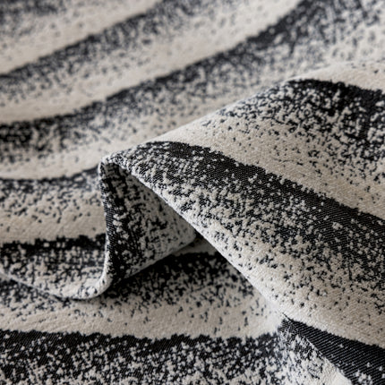 a close up of a black and white blanket