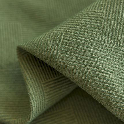 a close up view of a green fabric