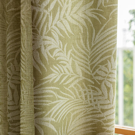 a close up of a window with a curtain