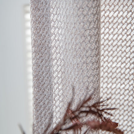 a close up of a curtain with a lizard on it
