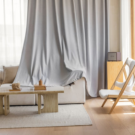 a living room with a white couch and a coffee table