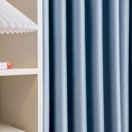 a shelf with a lamp and a blue curtain