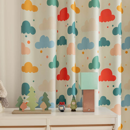 a teddy bear sitting on a dresser next to a window