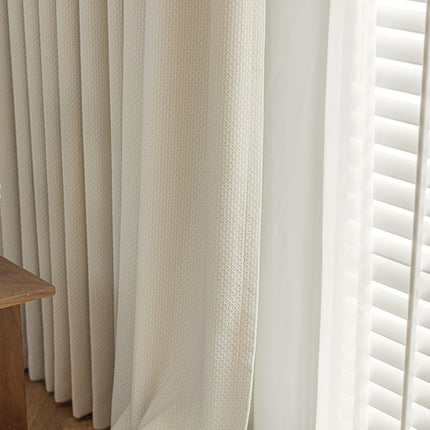 a close up of a window with white curtains