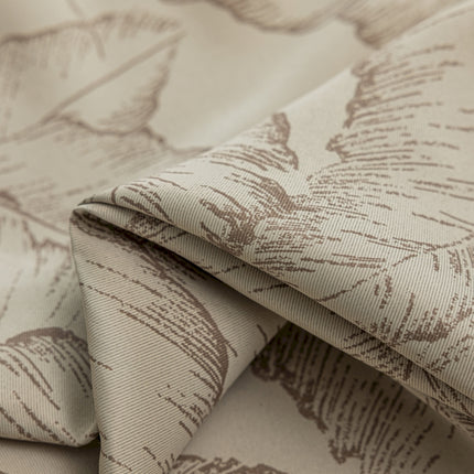 a close up of a fabric with leaves on it