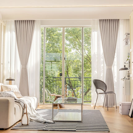 a living room filled with furniture and a large window