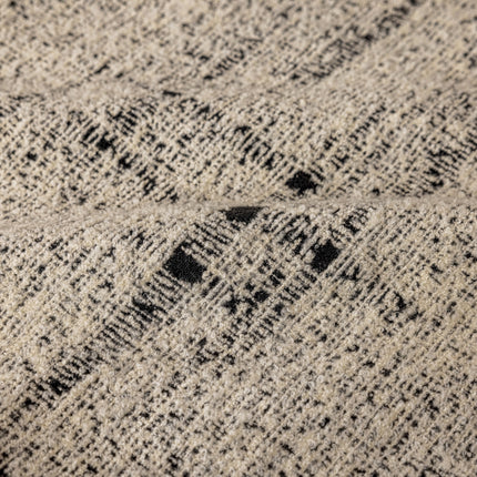 a close up of a black and white blanket