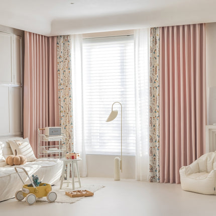 a living room with pink curtains and a white couch