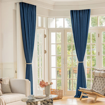 a living room filled with furniture and a large window