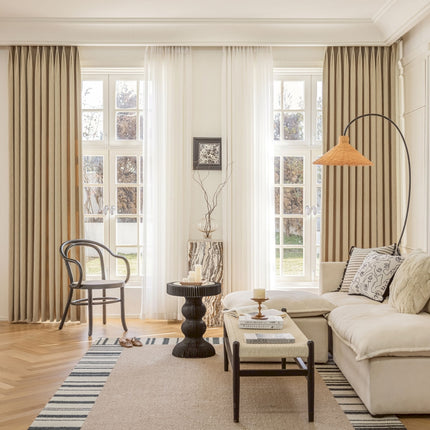 a living room filled with furniture and a large window