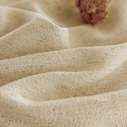 a piece of cake sitting on top of a white cloth