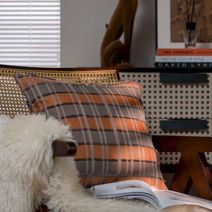 a dog is sitting on a chair with a book