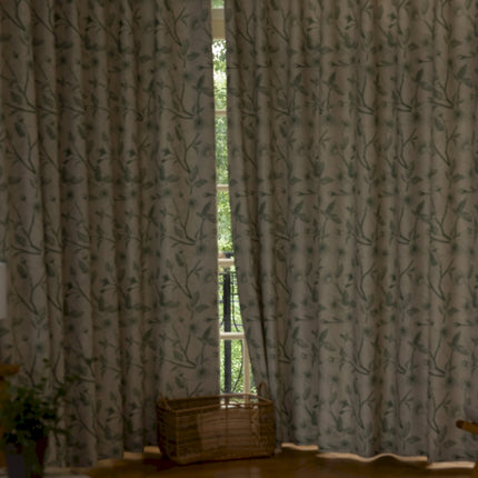a living room with a large window and a chair