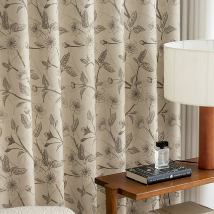 a table with a lamp and a book on it