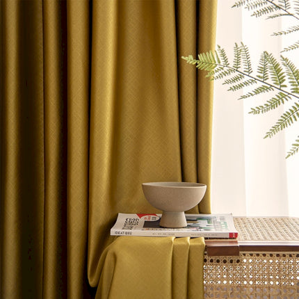 a bowl on a table next to a window