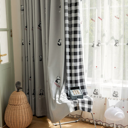 a room with a checkered curtain and a phone