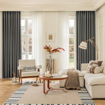 a living room filled with furniture and a large window