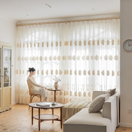 a woman sitting in a chair in front of a window