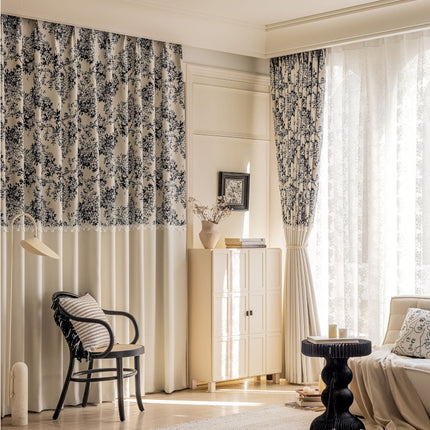 a living room filled with furniture and curtains