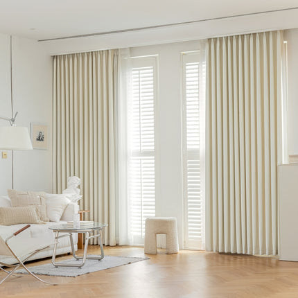 a living room with a white couch and a table