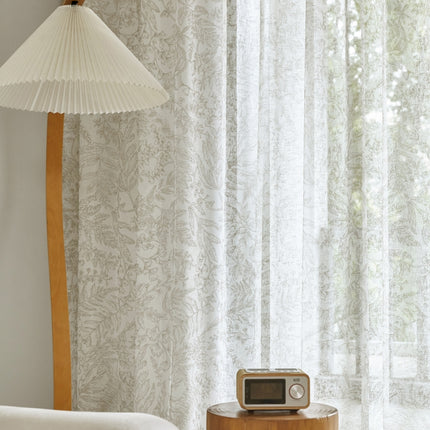 a room with a lamp and a radio on a table