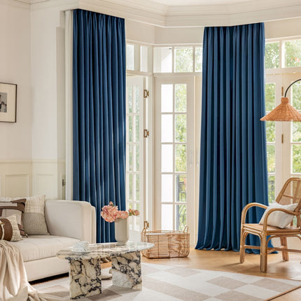 a living room filled with furniture and a large window