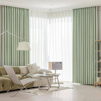 a living room filled with furniture and a large window