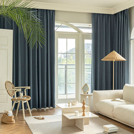 a living room filled with furniture and a large window