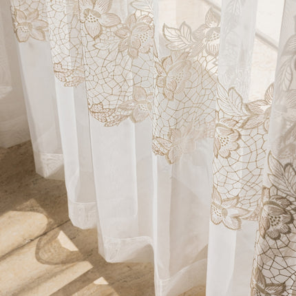 a close up of a window with a curtain