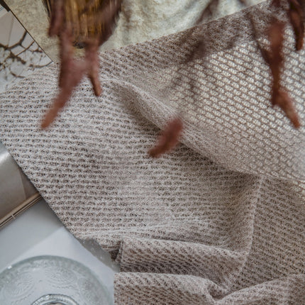 a close up of a towel and a sink