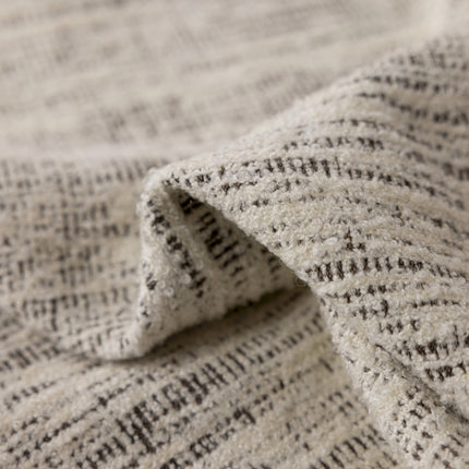 a close up of a white and black blanket