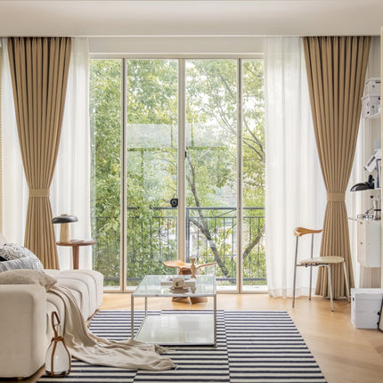 a living room filled with furniture and a large window