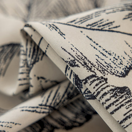 a close up of a tie with a design on it