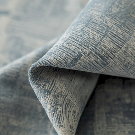 a close up of a blue and white fabric
