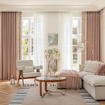 a living room filled with furniture and a large window